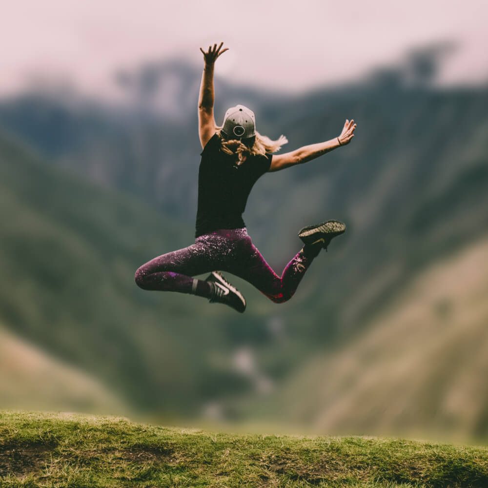 Selected area to remove background of girl jumping high 